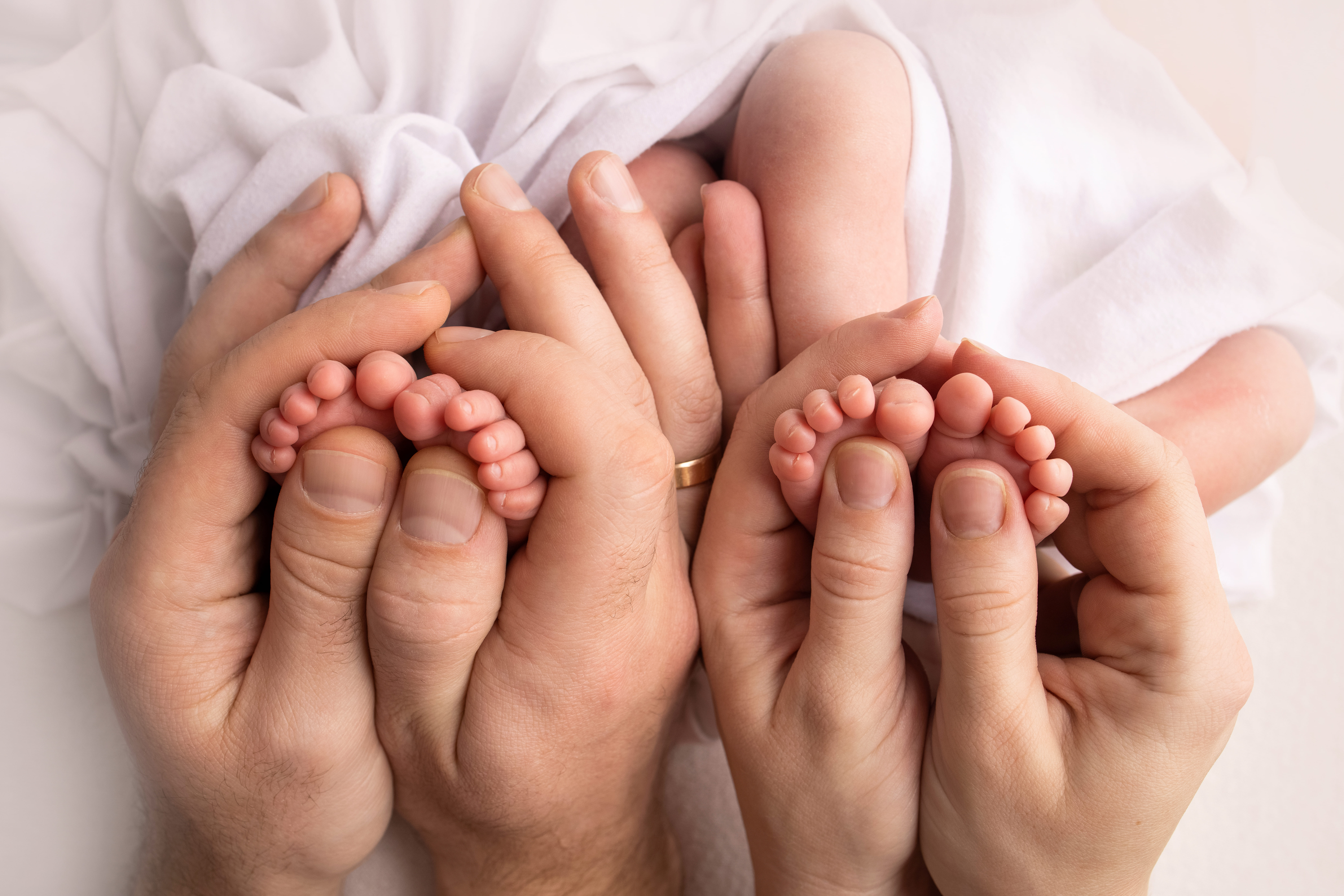 feet-of-newborn-twins-parents-father-mother-hold-2025-02-10-04-26-54-utc (1)_(1)